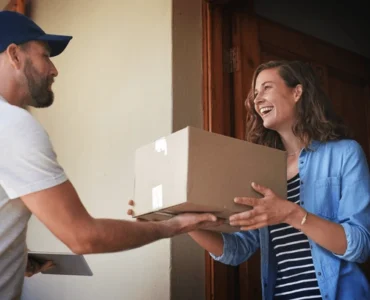 happy-woman-delivery-man-package-600nw-2304125563