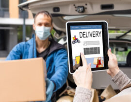 191816429-female-hands-holding-tablet-with-food-delivery-app-on-screen