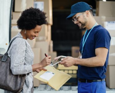 woman-signing-for-package
