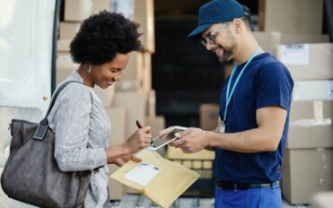 woman-signing-for-package